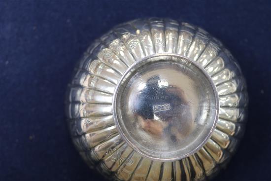 A Chinese silver sugar bowl and two tea strainers.